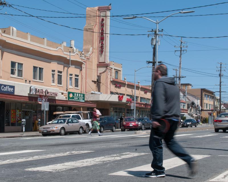 Pedestrians walking across Geneva Ave in Crocker-Amazon neighborhood