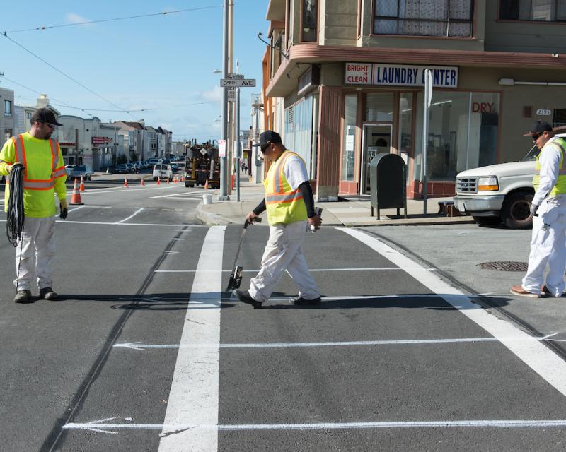 SFMTA staff working on a new crosswalk