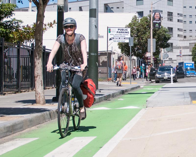 girl riding bike on 8th street