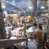 A large bulldozer approaches the excavation spoils collection and sorting area under the main access shaft inside the Chinatown 