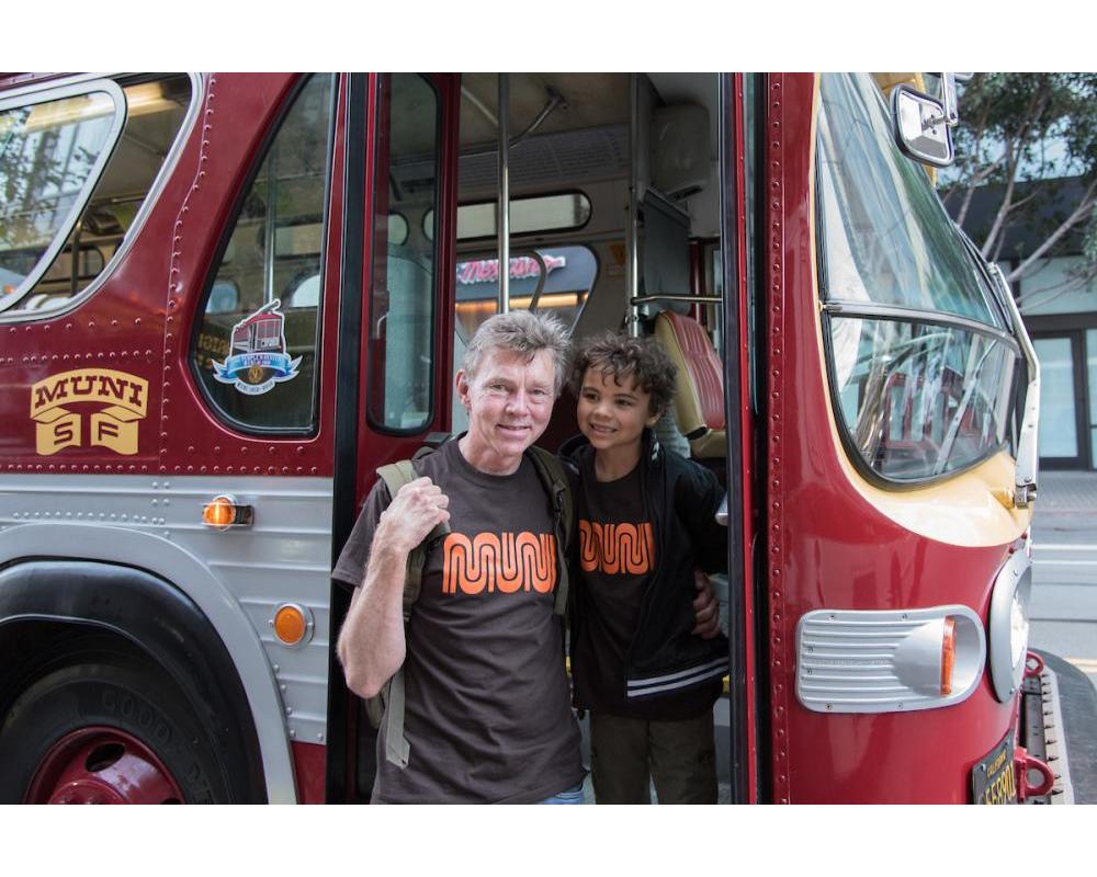 Two users of the system getting on the bus.