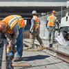 Sections of rail are bolted down on the west side of the tunnel portal, just north of the 4th and Bryant intersection.