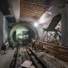 Workers construct final structural elements of the Yerba Buena/Moscone station platform.