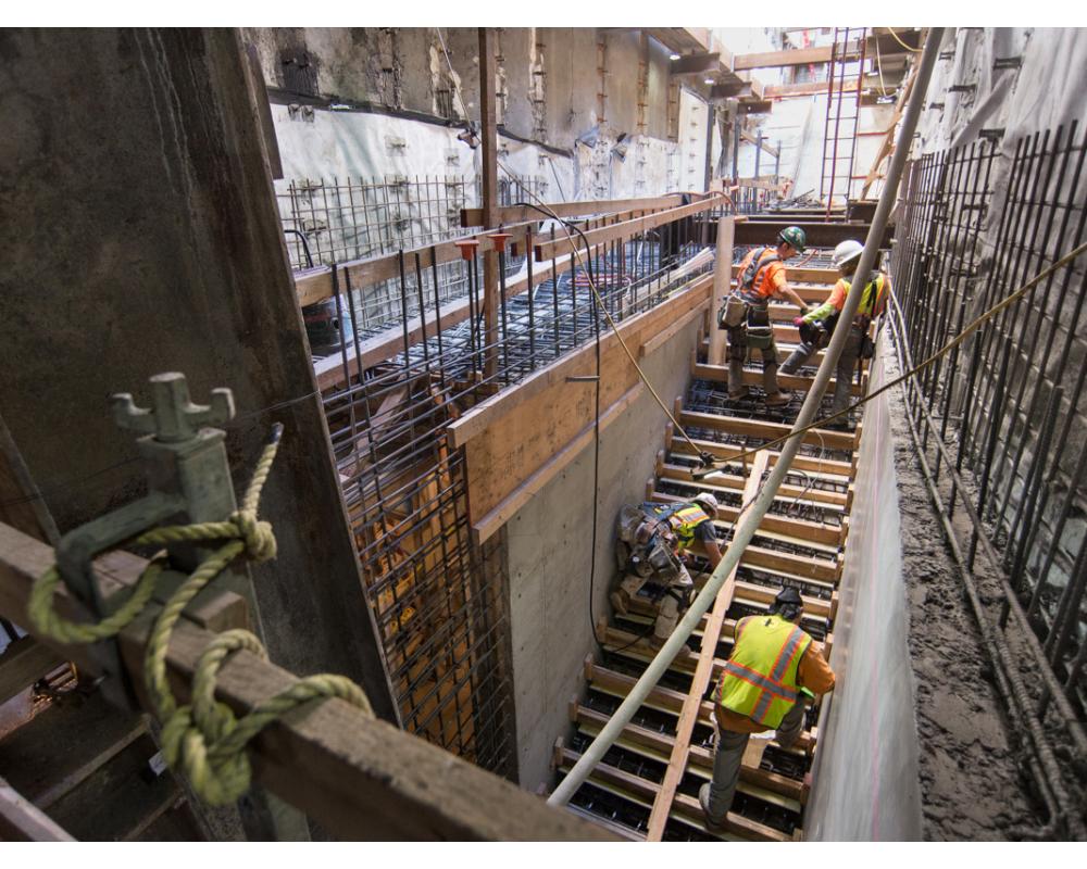 Concrete forms are constructed for future emergency egress stairs on the east side of Stockton at O'Farrell.