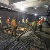 A crew pours concrete around future elevator footings inside the Yerba Buena/Moscone station box.