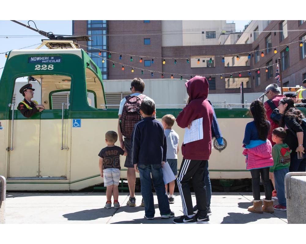 An operator shows children the SFMTA boat streetcar.