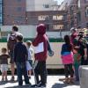 An operator shows children the SFMTA boat streetcar.