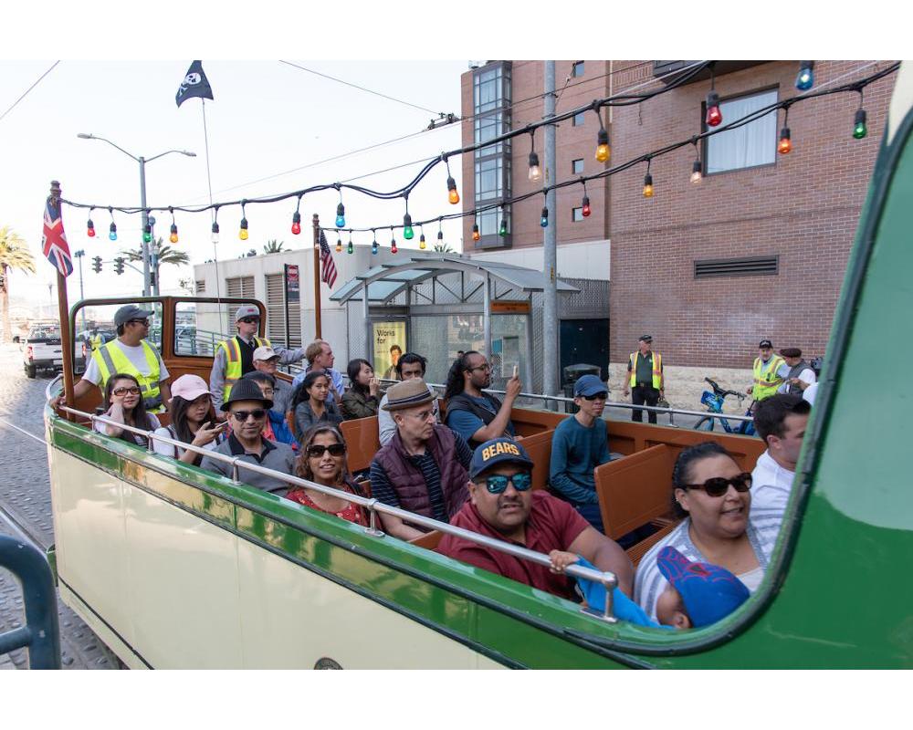 Riders sitting in the boat streetcar.