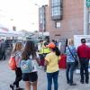 Small group of community members learn about the SFMTA at community event.