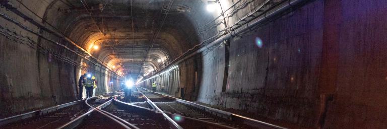 Photo of workers conducting inspections inside the Twin Peaks Tunnel