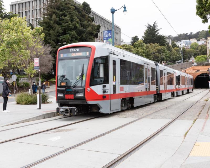 N Judah train on the street.