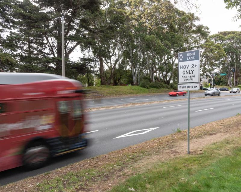 bus driving on high occupancy vehicle lane on park presidio 