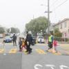 Kids cross Slow Hearst on their way to school.