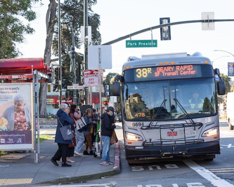 People boarding the 38R at Park Presidio and Geary