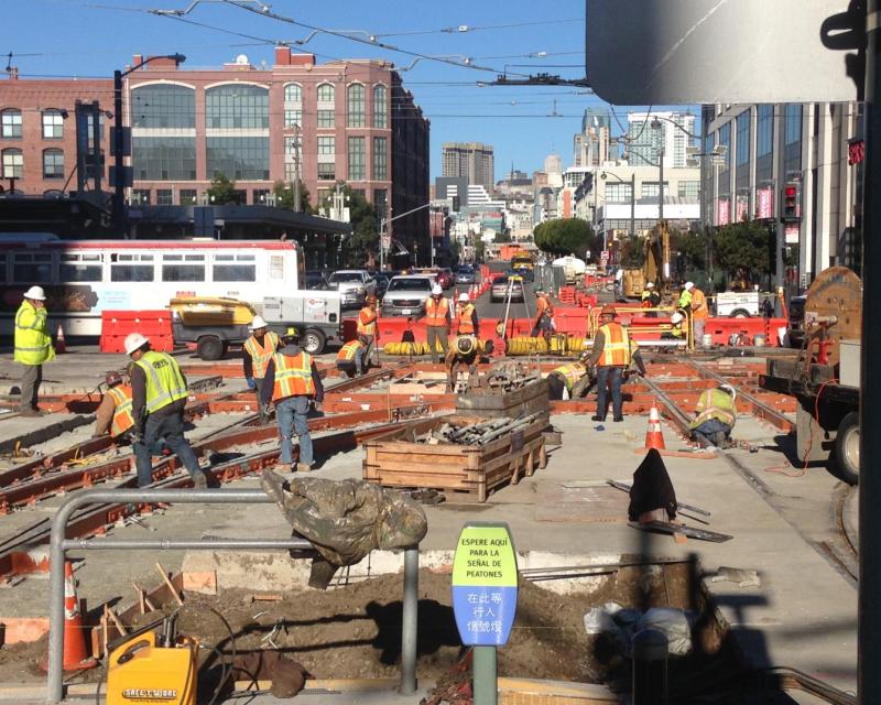 Workers on 4th Street near King