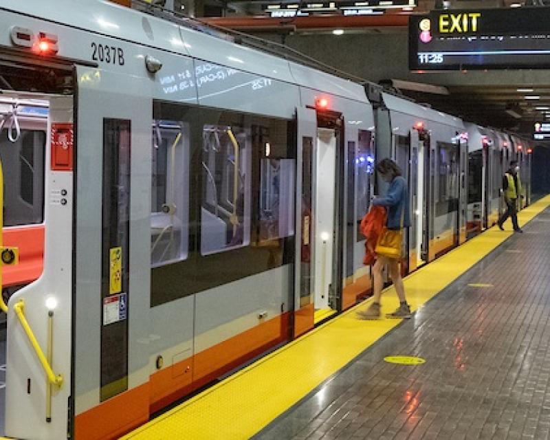 Passengers entering and exiting train at Church Station