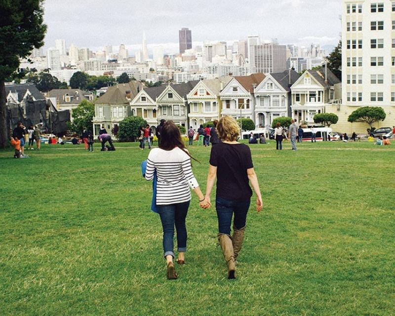 Couple walking through Alamo Square Park