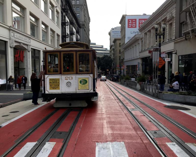 Image of a person boarding a cable car on Powell Street