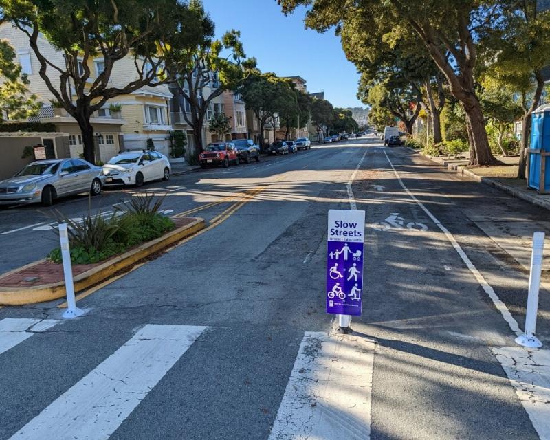 a slow streets program sign on lake street