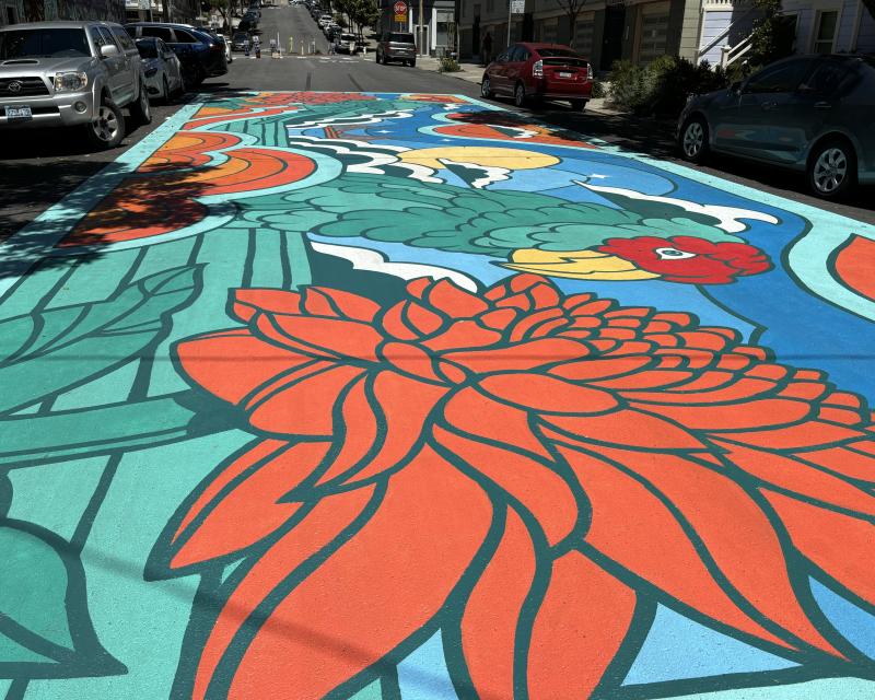 The Lyon Slow Street mural. Features a colorful flower pattern. 