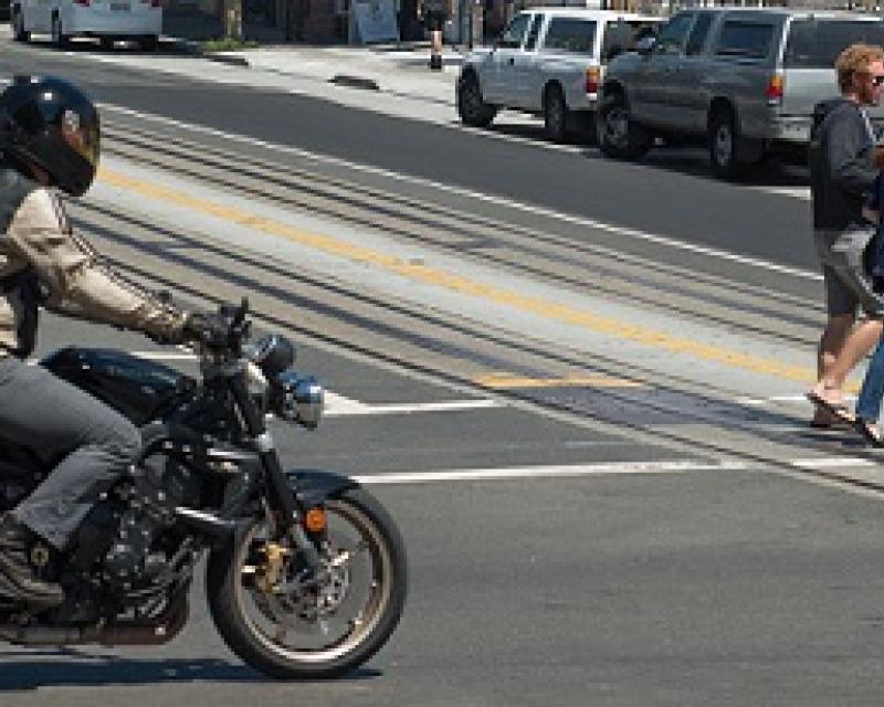 Motorcycle crossing an intersection.