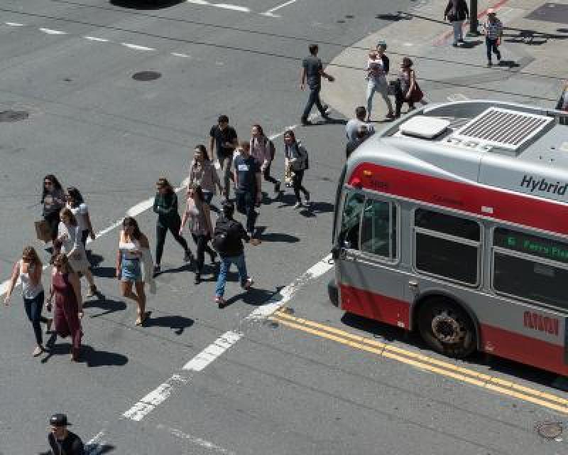 Image of people walking safely in a crosswalk