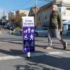 People crossing Slow Sanchez Street