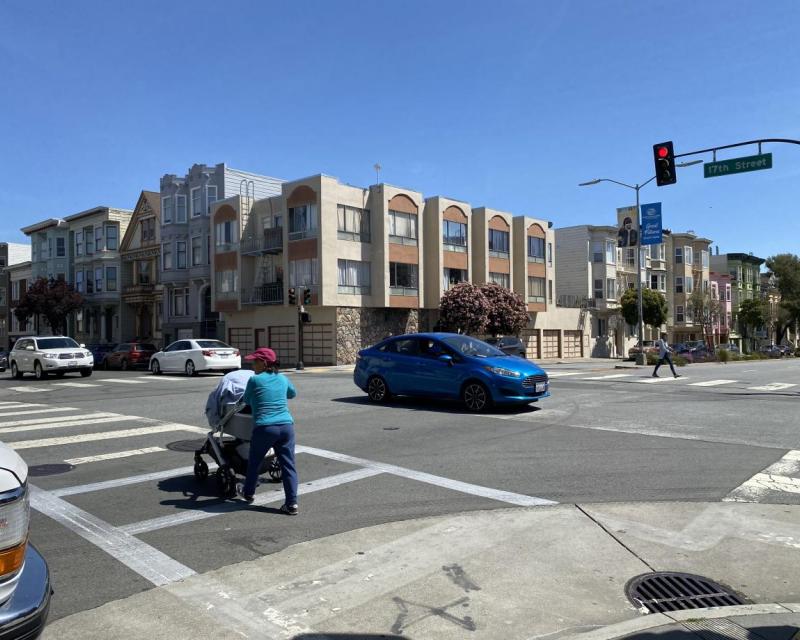 Pedestrian with stroller crossing Guerrero